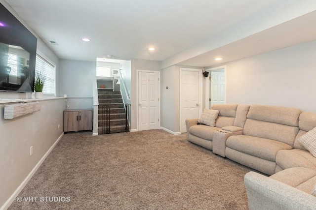 carpeted living room featuring stairs, recessed lighting, baseboards, and visible vents