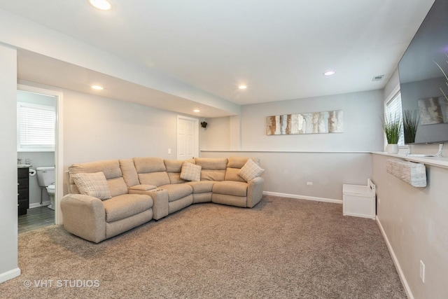 living area with recessed lighting, baseboards, and carpet