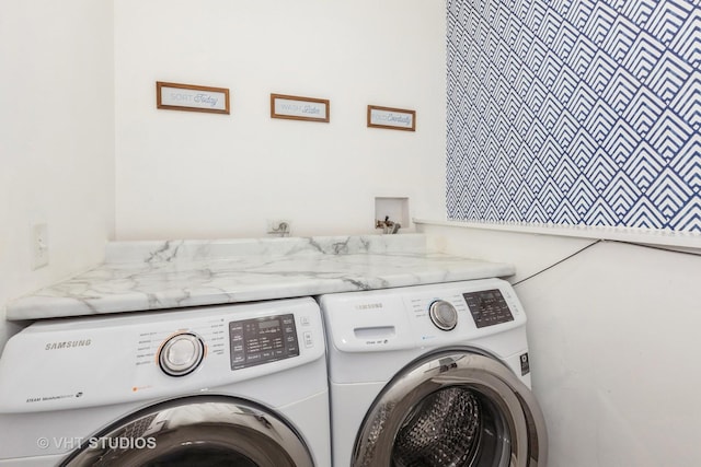 laundry area with laundry area and washer and clothes dryer