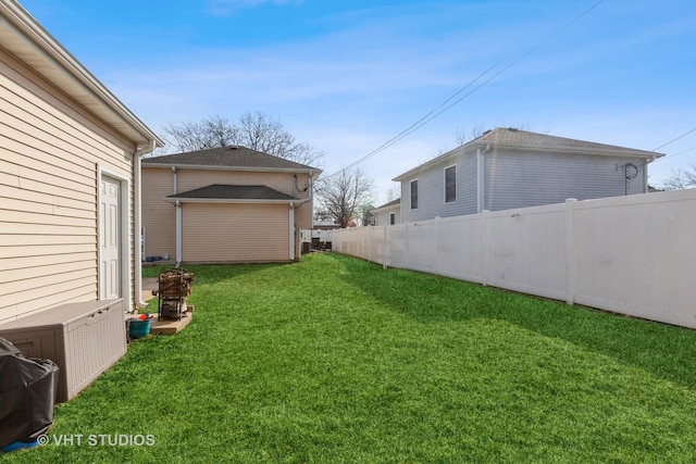 view of yard featuring an outdoor structure and fence