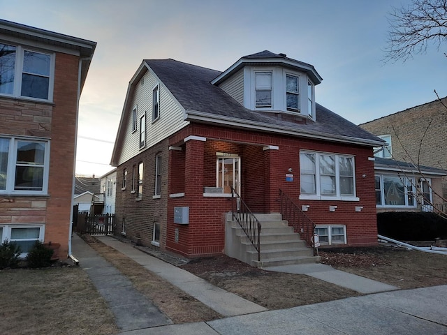 view of front of property featuring brick siding