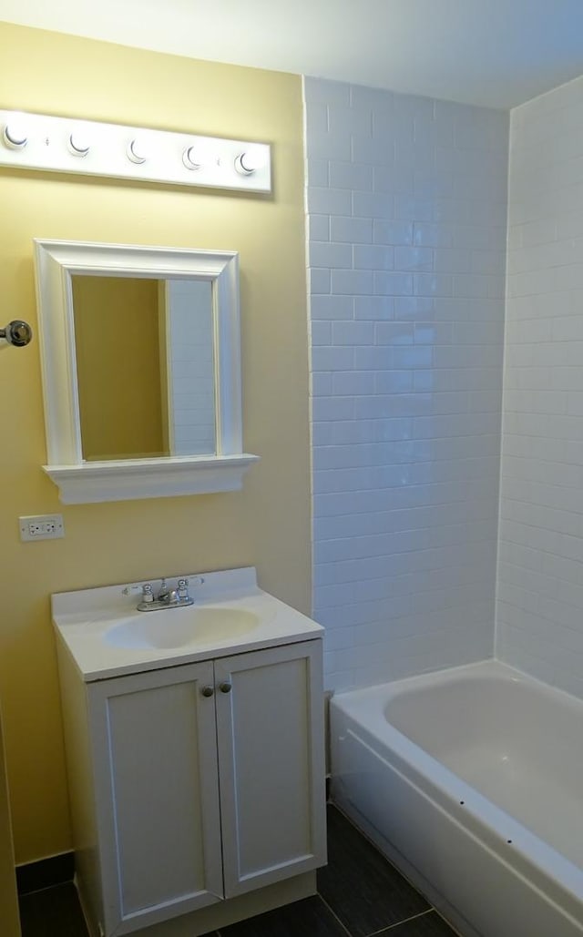 bathroom featuring vanity and shower / tub combination