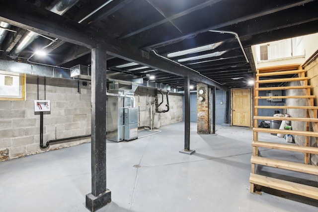 unfinished basement featuring heating unit