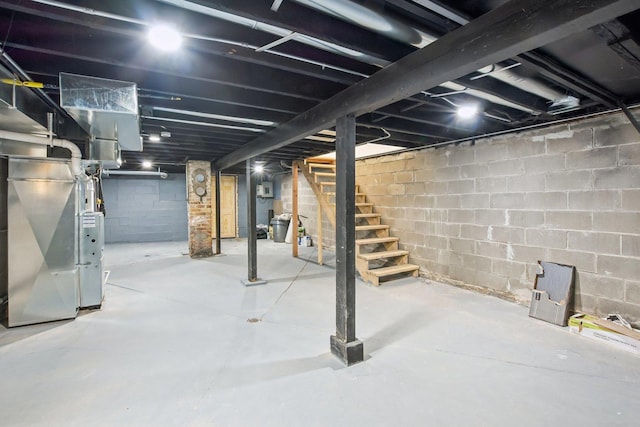 unfinished basement with heating unit and stairway