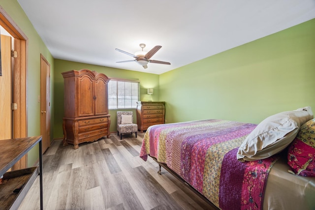 bedroom featuring ceiling fan and light wood-style floors