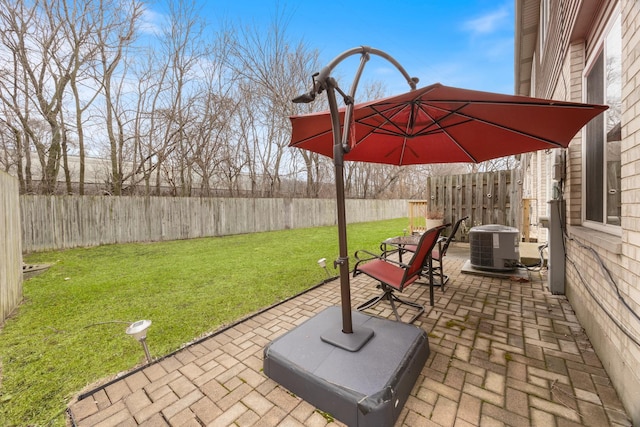 view of patio / terrace with central AC unit and a fenced backyard