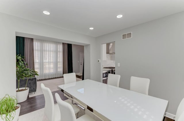 dining area featuring recessed lighting, visible vents, and wood finished floors