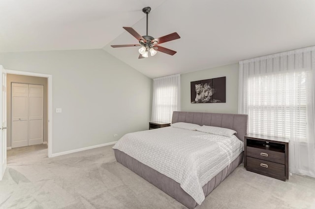 bedroom featuring lofted ceiling, light colored carpet, baseboards, and ceiling fan