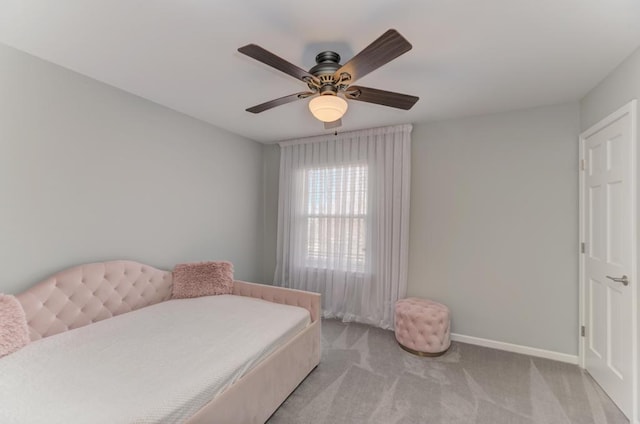 bedroom featuring baseboards, carpet floors, and ceiling fan