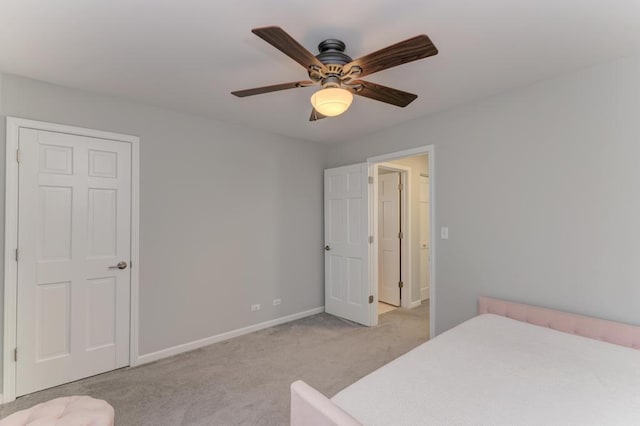 bedroom with baseboards, light colored carpet, and ceiling fan