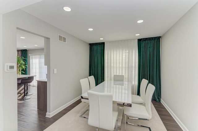 dining room with recessed lighting, visible vents, baseboards, and wood finished floors