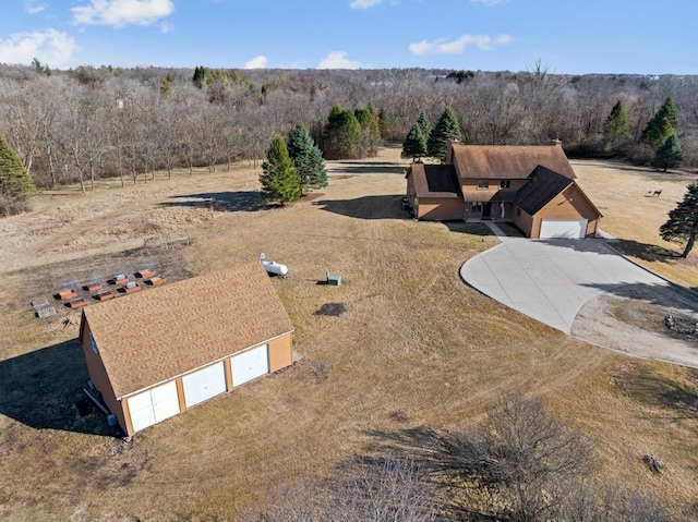 drone / aerial view featuring a view of trees