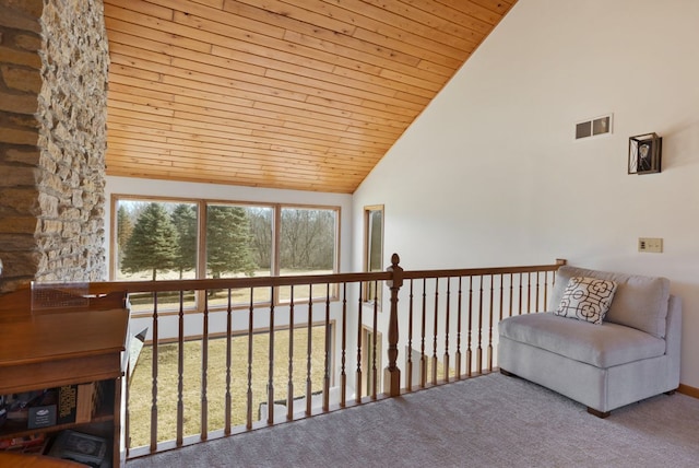 living area featuring visible vents, wooden ceiling, high vaulted ceiling, and carpet