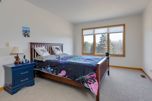 bedroom featuring light carpet, visible vents, and baseboards