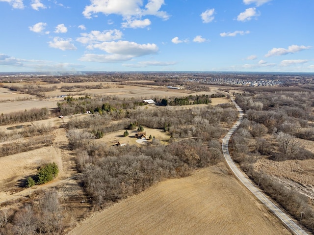 birds eye view of property with a rural view