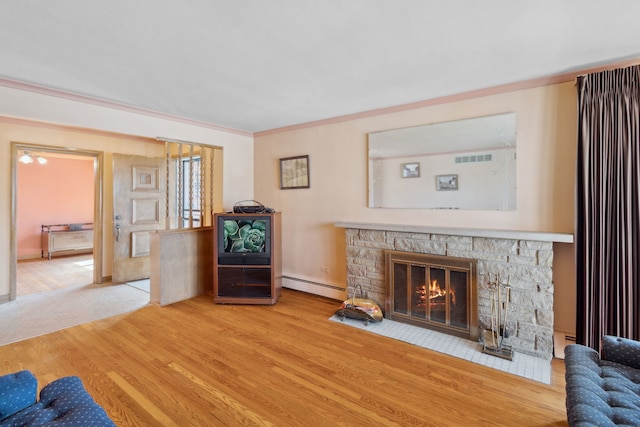 unfurnished living room with a stone fireplace, crown molding, wood finished floors, and baseboard heating