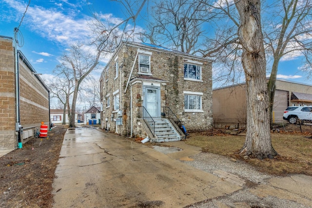 view of front facade featuring stone siding