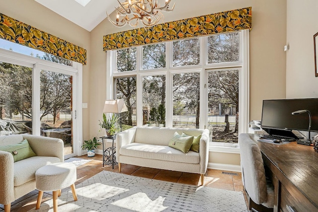 interior space featuring a notable chandelier, plenty of natural light, and vaulted ceiling