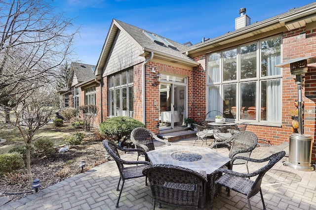 view of patio featuring outdoor dining area