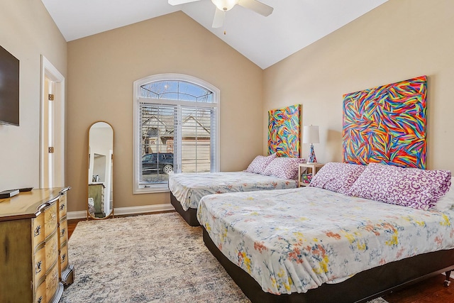 bedroom featuring vaulted ceiling, baseboards, and ceiling fan