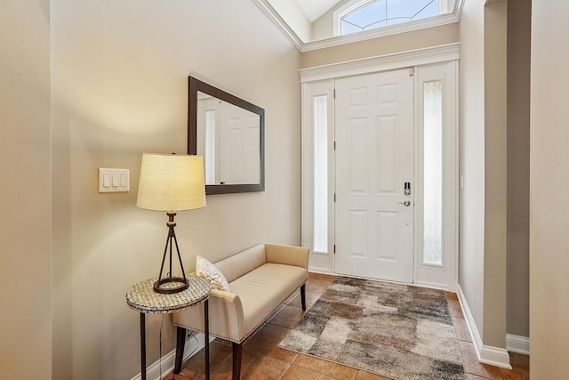 foyer featuring lofted ceiling and baseboards