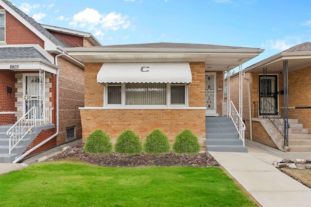 property entrance featuring brick siding