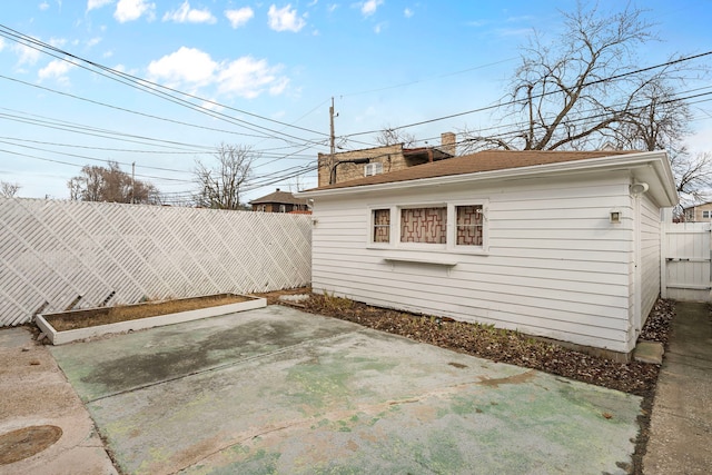 exterior space with an outbuilding and a fenced backyard