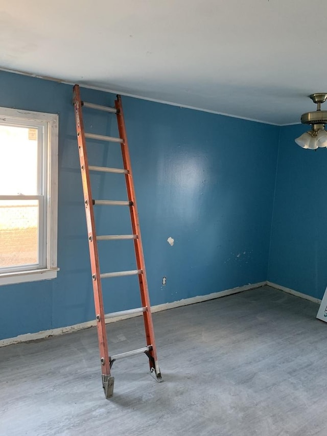 spare room with baseboards