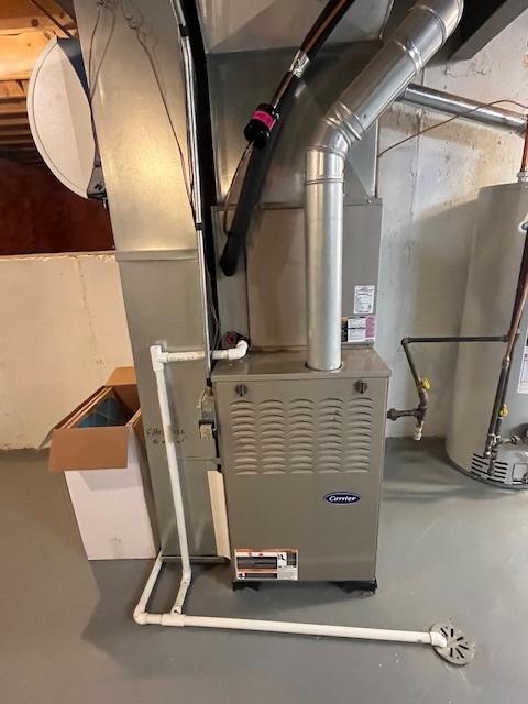 utility room with water heater