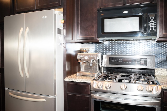 kitchen with light stone counters, backsplash, appliances with stainless steel finishes, and dark brown cabinetry