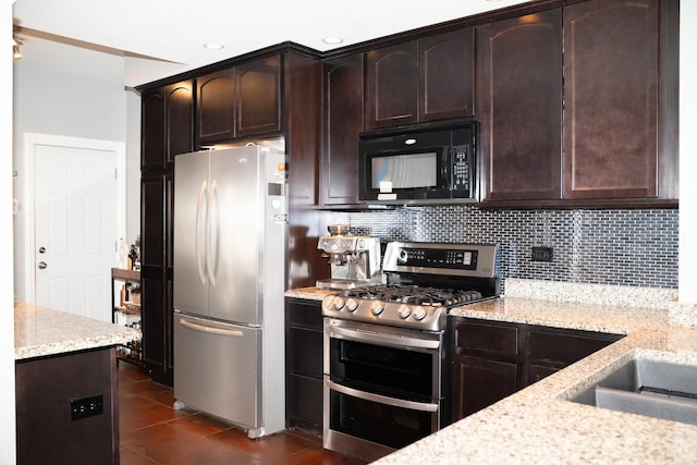 kitchen with light stone counters, stainless steel appliances, dark brown cabinetry, and decorative backsplash