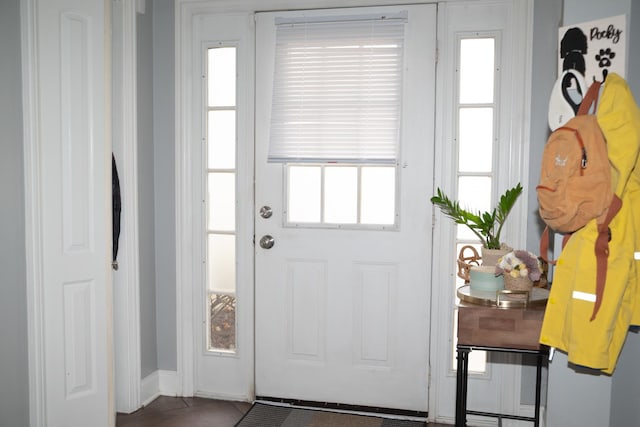 doorway featuring tile patterned flooring