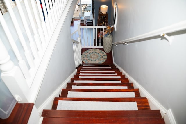 stairway featuring baseboards