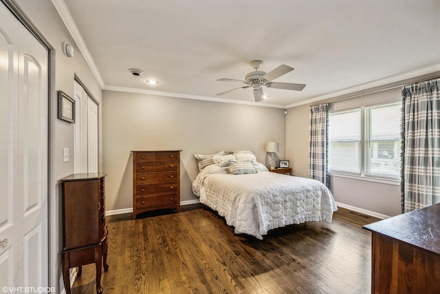 bedroom featuring crown molding, baseboards, and dark wood-style flooring