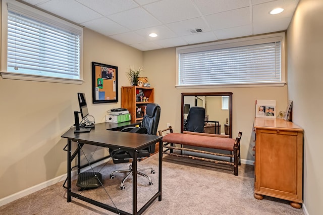 home office featuring visible vents, light colored carpet, and baseboards