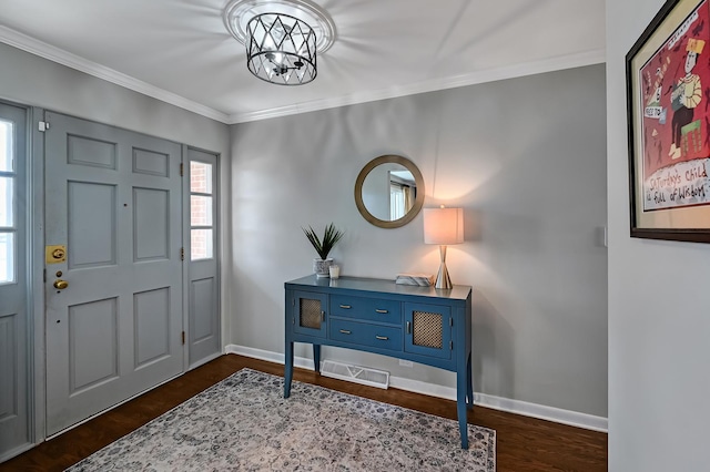 entrance foyer featuring a chandelier, wood finished floors, baseboards, and ornamental molding