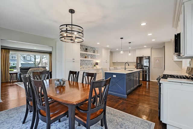 dining room featuring recessed lighting, a notable chandelier, and dark wood-style flooring