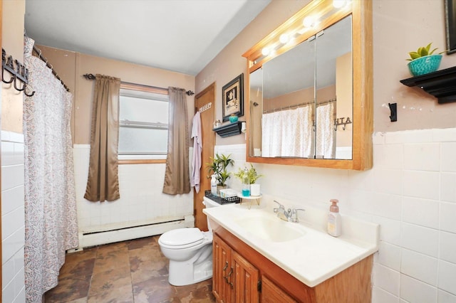 full bathroom with vanity, tile walls, wainscoting, and a baseboard radiator