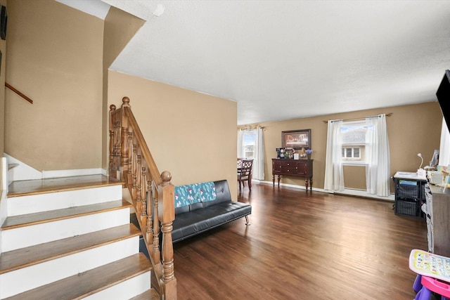 stairs featuring wood finished floors