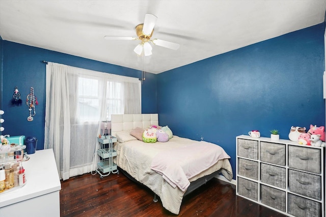 bedroom with a ceiling fan and wood finished floors