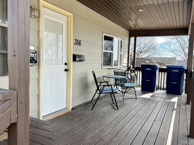 wooden terrace with a porch