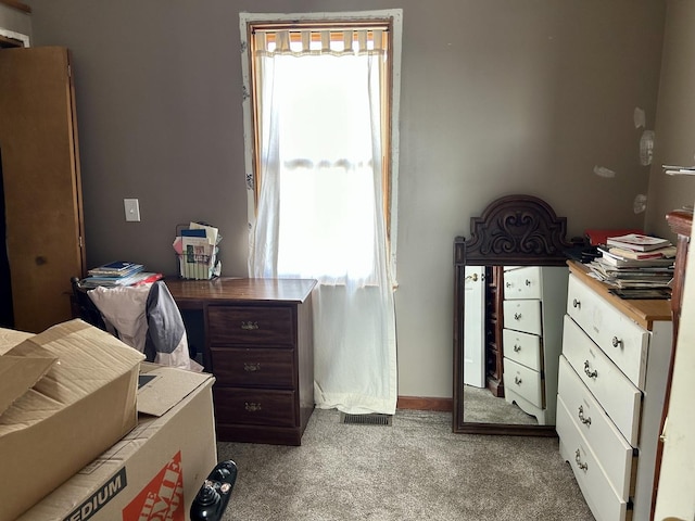 carpeted bedroom with multiple windows and baseboards