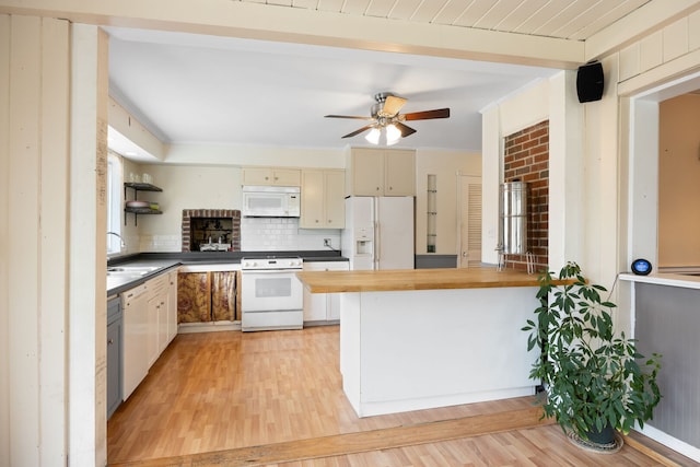 4708 Lawn Ave, Western Springs, IL 60558 - kitchen with ceiling fan, white appliances, butcher block counters, light wood-type flooring, and a peninsula