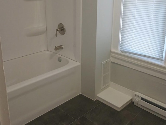 bathroom featuring visible vents, baseboard heating, and tile patterned flooring