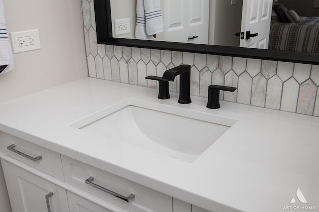 interior details with decorative backsplash and vanity