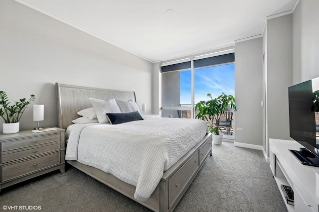 bedroom featuring baseboards, ornamental molding, access to exterior, expansive windows, and dark carpet