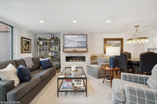 living area with recessed lighting and a large fireplace