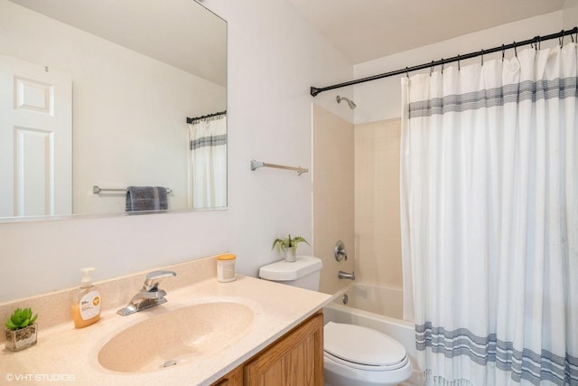 full bathroom with shower / bath combo with shower curtain, toilet, and vanity