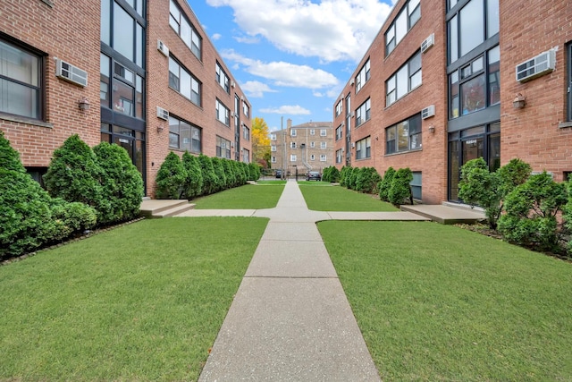 view of home's community with a lawn