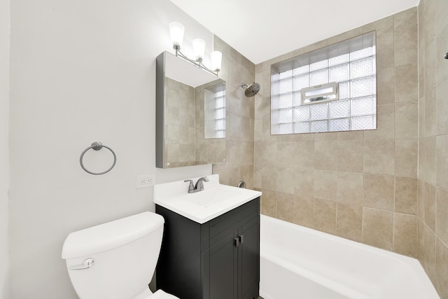 bathroom featuring shower / bath combination, toilet, and vanity